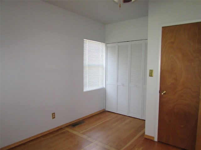 2323 3rd Ave S, Great Falls, MT 59405 - unfurnished bedroom with wood finished floors, baseboards, and a closet