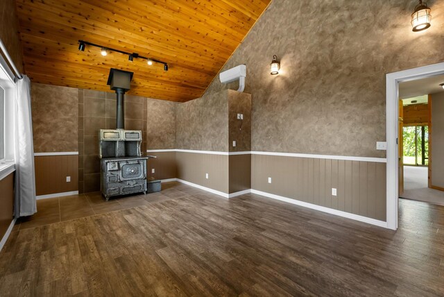 45 Panoramic Dr, Kalispell, MT 59901 - unfurnished living room with track lighting, lofted ceiling, wood finished floors, wainscoting, and wood ceiling