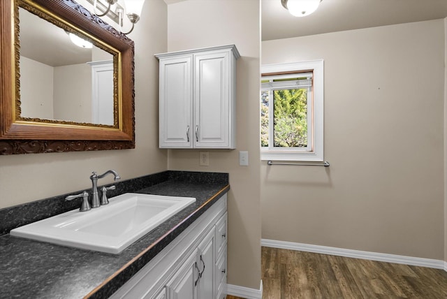 45 Panoramic Dr, Kalispell, MT 59901 - bathroom with wood finished floors, vanity, and baseboards