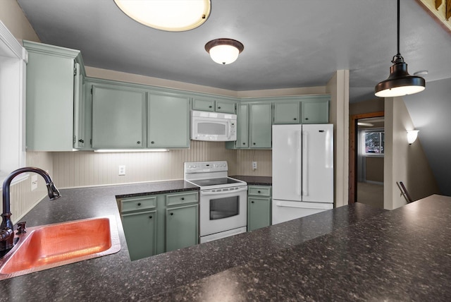 45 Panoramic Dr, Kalispell, MT 59901 - kitchen featuring white appliances, a sink, green cabinets, and pendant lighting