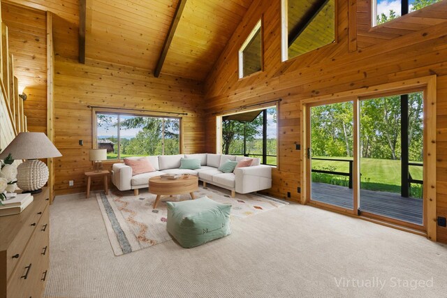 45 Panoramic Dr, Kalispell, MT 59901 - living room featuring plenty of natural light, carpet, wooden walls, and wooden ceiling with exposed beams