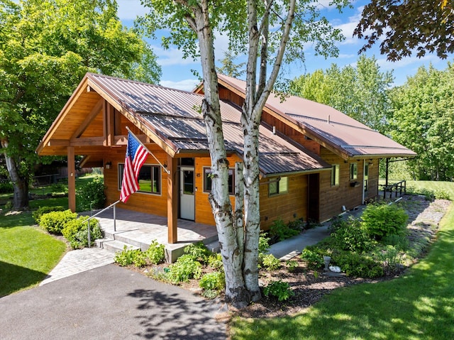 45 Panoramic Dr, Kalispell, MT 59901 - view of front facade featuring metal roof and a front lawn