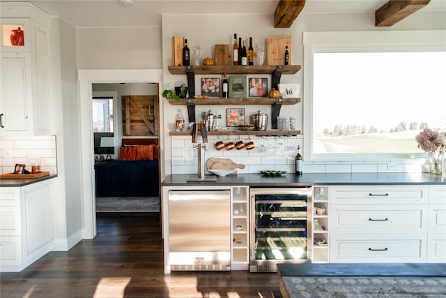 8138 Ranch Club Rd, Missoula, MT 59808 - indoor wet bar featuring wine cooler, dark wood-type flooring, decorative backsplash, and fridge