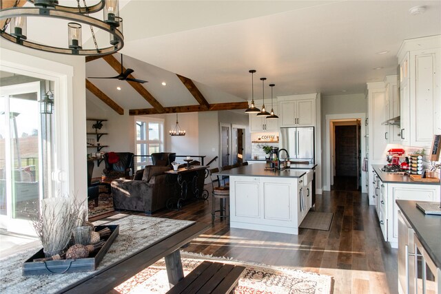 8138 Ranch Club Rd, Missoula, MT 59808 - kitchen featuring dark countertops, a chandelier, appliances with stainless steel finishes, white cabinetry, and recessed lighting