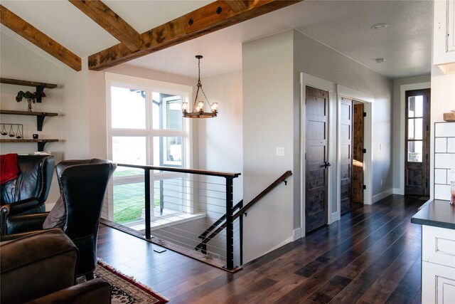 8138 Ranch Club Rd, Missoula, MT 59808 - living area featuring dark wood-type flooring, baseboards, a chandelier, and beam ceiling