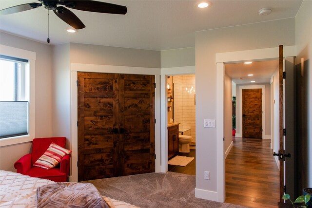 8138 Ranch Club Rd, Missoula, MT 59808 - bedroom featuring wood finished floors, recessed lighting, ensuite bathroom, and baseboards
