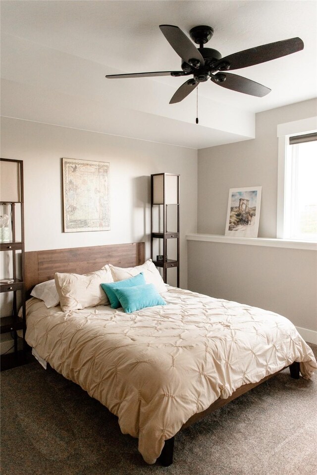 8138 Ranch Club Rd, Missoula, MT 59808 - carpeted bedroom with a ceiling fan
