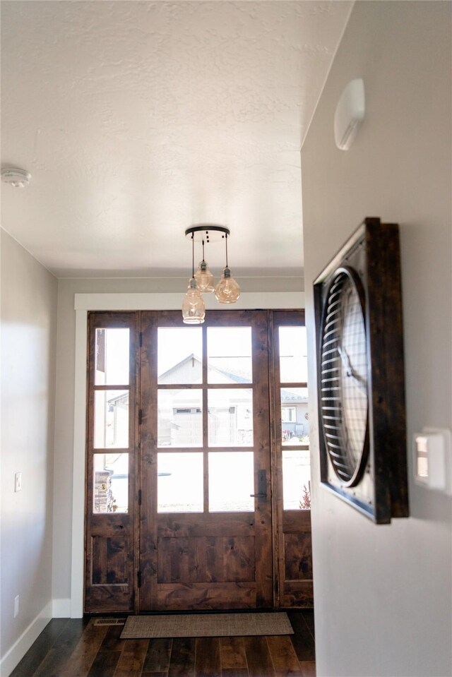 8138 Ranch Club Rd, Missoula, MT 59808 - entrance foyer featuring dark wood-style floors and baseboards