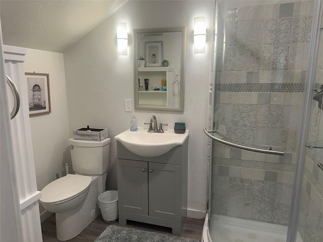 1265 Jellison Rd, Columbia Falls, MT 59912 - full bathroom featuring vanity, a shower stall, and wood finished floors