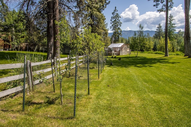 1265 Jellison Rd, Columbia Falls, MT 59912 - view of yard with a mountain view and an outdoor structure
