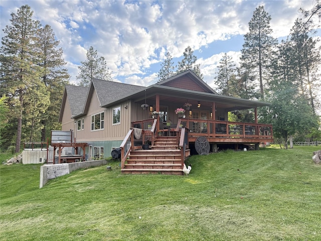 1265 Jellison Rd, Columbia Falls, MT 59912 - back of property with a lawn, a shingled roof, and board and batten siding