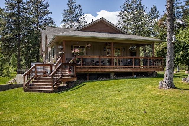 1265 Jellison Rd, Columbia Falls, MT 59912 - back of house with roof with shingles, a yard, and board and batten siding
