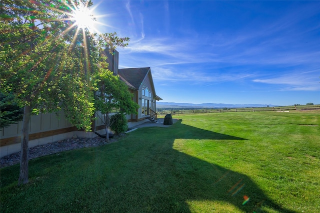 6659 Lamar Trl, Florence, MT 59833 - view of yard featuring entry steps, a view of rural / pastoral area, and a mountain view
