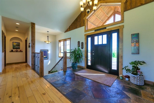 6659 Lamar Trl, Florence, MT 59833 - foyer entrance with a chandelier, high vaulted ceiling, and recessed lighting