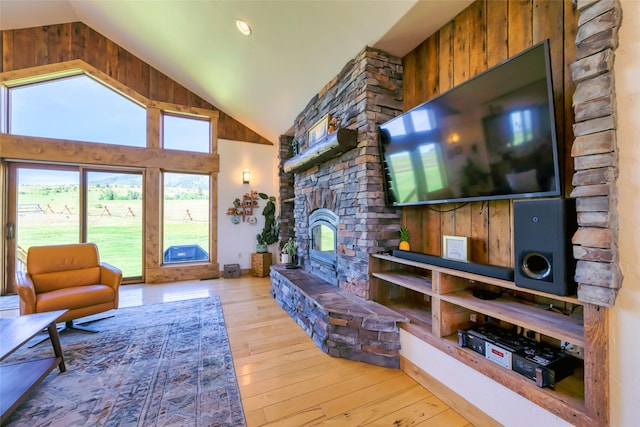 6659 Lamar Trl, Florence, MT 59833 - living room with a fireplace, wood-type flooring, and high vaulted ceiling