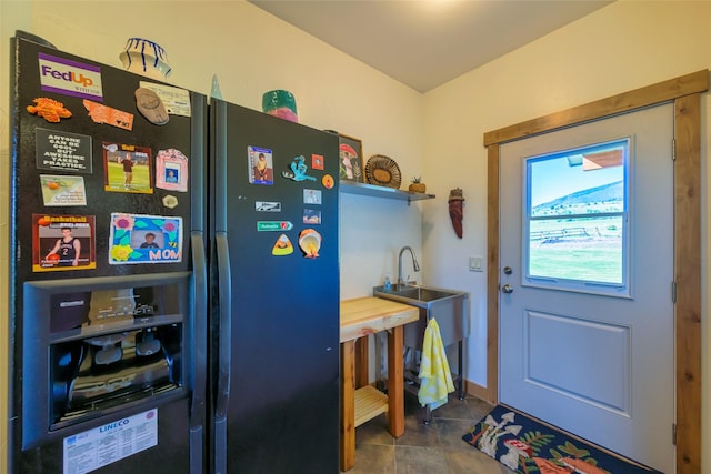 6659 Lamar Trl, Florence, MT 59833 - doorway featuring tile patterned flooring and a sink