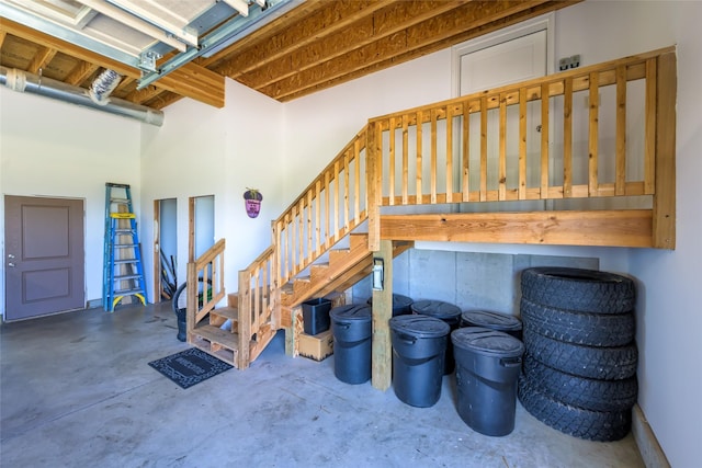 6659 Lamar Trl, Florence, MT 59833 - stairway with concrete flooring and a towering ceiling