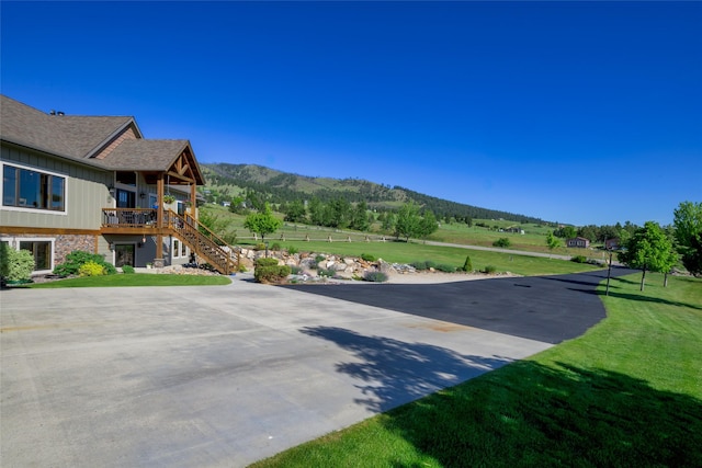 6659 Lamar Trl, Florence, MT 59833 - view of patio / terrace with stairs and a mountain view