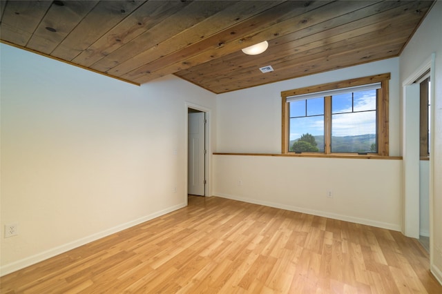 6659 Lamar Trl, Florence, MT 59833 - spare room with light wood-style flooring and wood ceiling