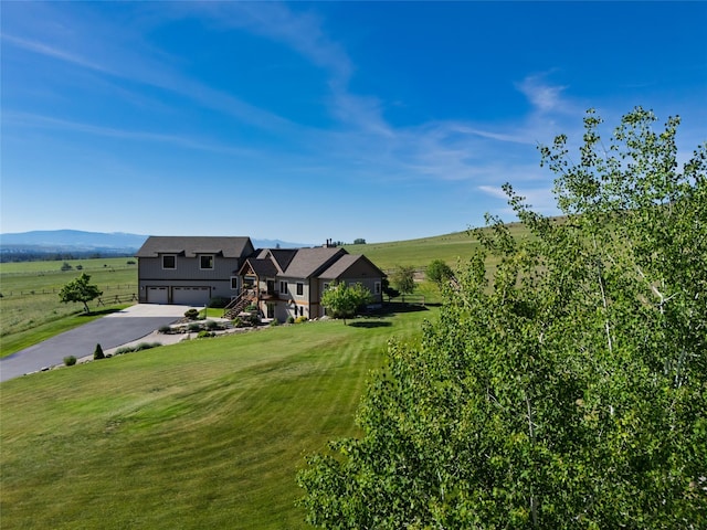 6659 Lamar Trl, Florence, MT 59833 - view of front of house featuring a garage, asphalt driveway, and a front yard