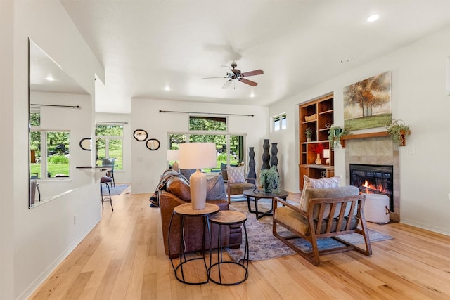 720 Anglers Bend Way, Missoula, MT 59802 - living area featuring light wood-style floors, a tile fireplace, ceiling fan, baseboards, and recessed lighting