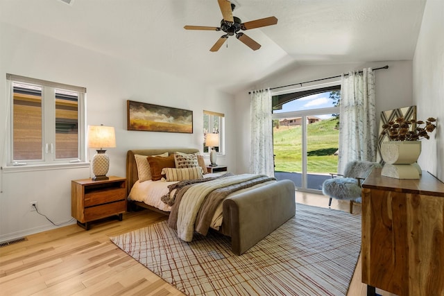 720 Anglers Bend Way, Missoula, MT 59802 - bedroom featuring access to exterior, vaulted ceiling, light wood-type flooring, a ceiling fan, and baseboards