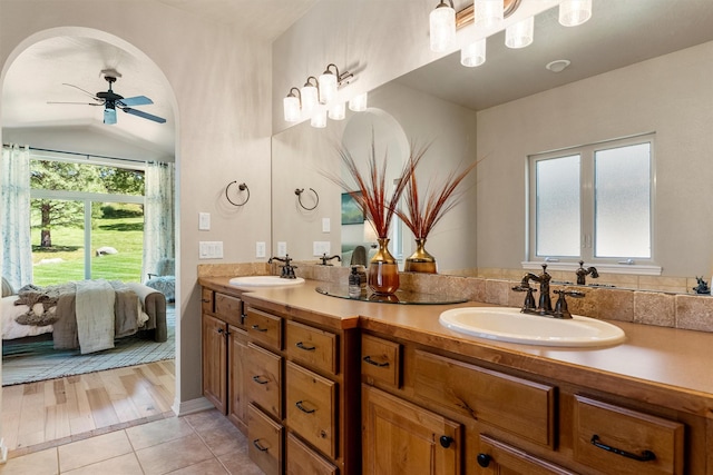 720 Anglers Bend Way, Missoula, MT 59802 - bathroom featuring double vanity, a ceiling fan, ensuite bathroom, tile patterned flooring, and lofted ceiling