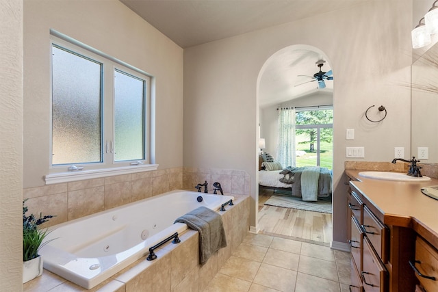 720 Anglers Bend Way, Missoula, MT 59802 - bathroom featuring vanity, a tub with jets, connected bathroom, ceiling fan, and tile patterned flooring