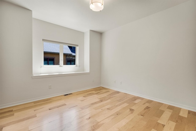 720 Anglers Bend Way, Missoula, MT 59802 - unfurnished room featuring wood finished floors and baseboards