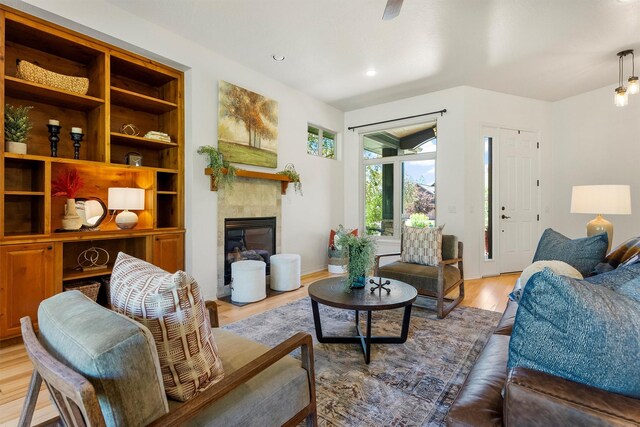 720 Anglers Bend Way, Missoula, MT 59802 - living area with wood finished floors, a tile fireplace, recessed lighting, and baseboards