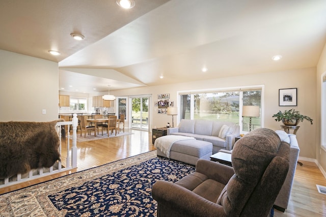 10190 Kona Ranch Rd, Missoula, MT 59808 - living area with light wood-style floors, recessed lighting, vaulted ceiling, and baseboards