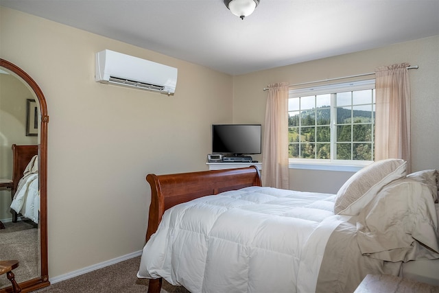 31683 S Rim Dr, Polson, MT 59860 - bedroom featuring an AC wall unit, carpet flooring, and baseboards