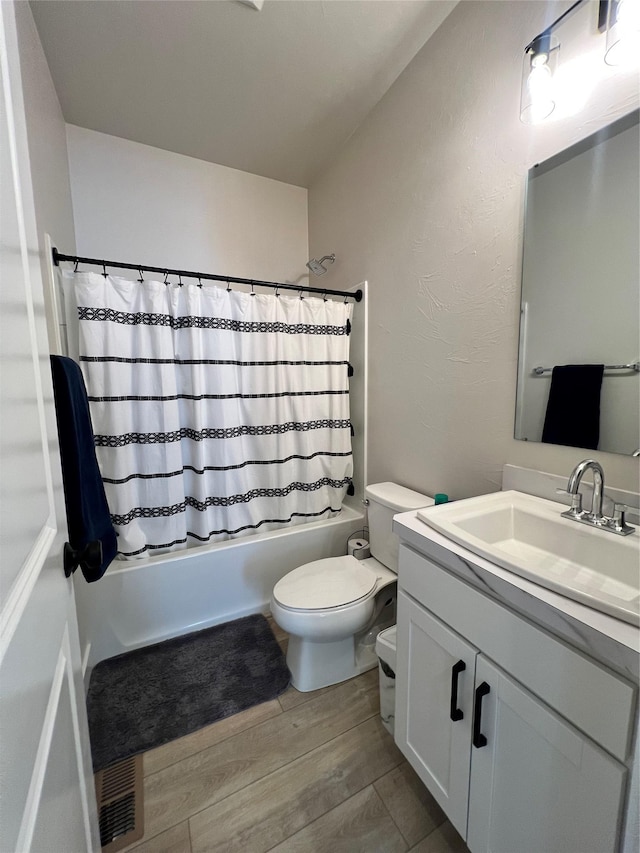 2883 Adam Run Ave, Helena, MT 59601 - full bathroom featuring vanity, toilet, shower / bathtub combination with curtain, and wood finished floors