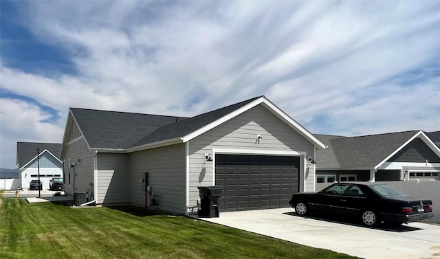 2883 Adam Run Ave, Helena, MT 59601 - view of side of property with driveway, a garage, a yard, and cooling unit