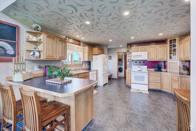 3380 Moulton Reservoir Rd, Butte, MT 59701 - kitchen with white appliances, washer / clothes dryer, a peninsula, open shelves, and light brown cabinetry