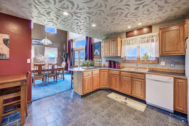 3380 Moulton Reservoir Rd, Butte, MT 59701 - kitchen with dishwasher, a sink, a peninsula, light countertops, and recessed lighting