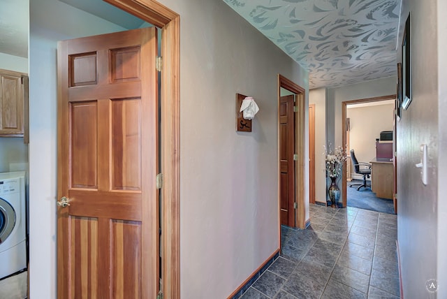 3380 Moulton Reservoir Rd, Butte, MT 59701 - hall with washer / clothes dryer, stone tile floors, an office area, and baseboards