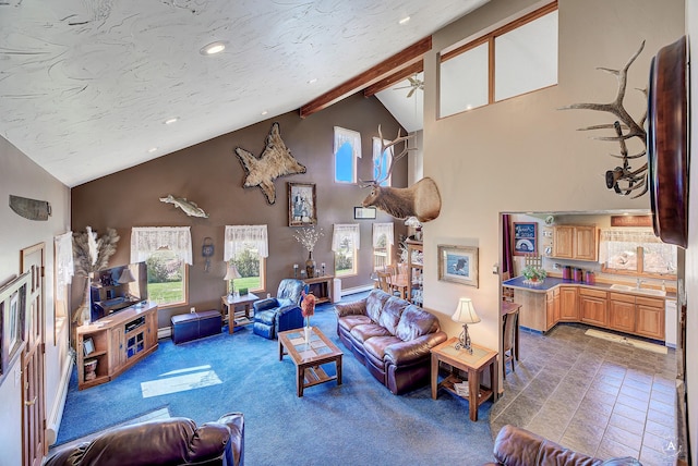 3380 Moulton Reservoir Rd, Butte, MT 59701 - living room featuring ceiling fan, high vaulted ceiling, recessed lighting, beamed ceiling, and carpet floors