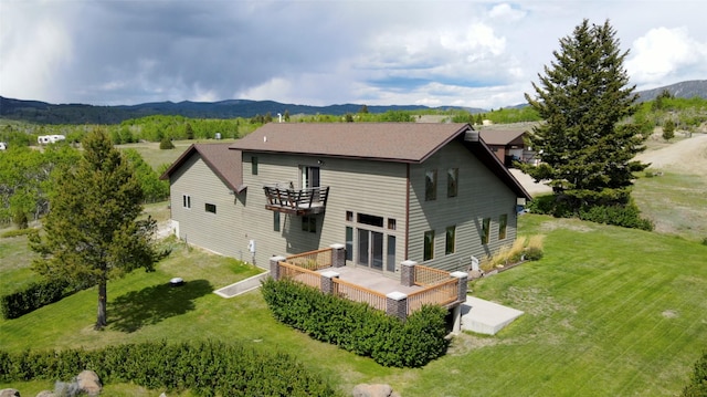 3380 Moulton Reservoir Rd, Butte, MT 59701 - rear view of house with a balcony, a yard, a deck with mountain view, and central AC unit