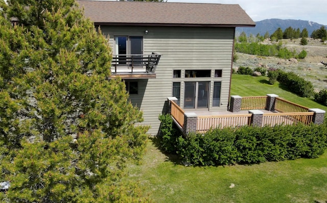 3380 Moulton Reservoir Rd, Butte, MT 59701 - back of house with a balcony, a mountain view, a yard, and a shingled roof