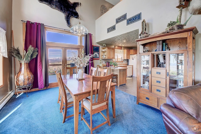 3380 Moulton Reservoir Rd, Butte, MT 59701 - carpeted dining space with a chandelier, a high ceiling, and a baseboard heating unit