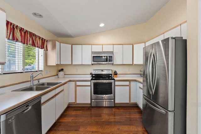 2249 Canvasback Ct, Kalispell, MT 59901 - kitchen featuring stainless steel appliances, a sink, lofted ceiling, light countertops, and white cabinetry