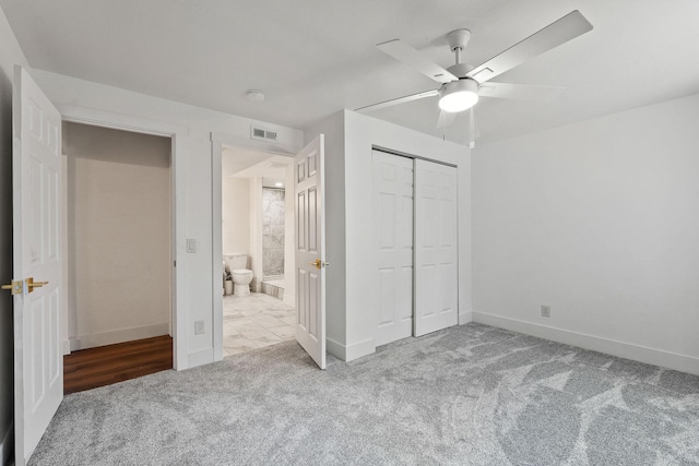 2249 Canvasback Ct, Kalispell, MT 59901 - unfurnished bedroom with carpet floors, baseboards, a closet, and ceiling fan