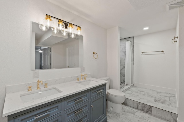 2249 Canvasback Ct, Kalispell, MT 59901 - full bathroom featuring marble look tiles, toilet, a shower with curtain, double vanity, and recessed lighting