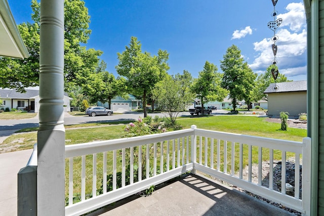 2249 Canvasback Ct, Kalispell, MT 59901 - porch featuring a residential view and a yard