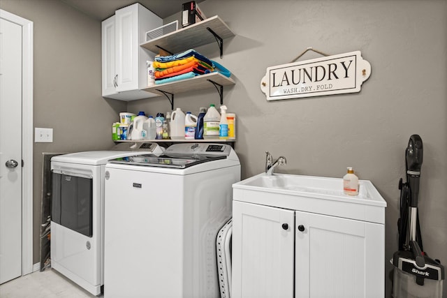 119 Barron Way, Kalispell, MT 59901 - laundry room with washer and clothes dryer and cabinet space