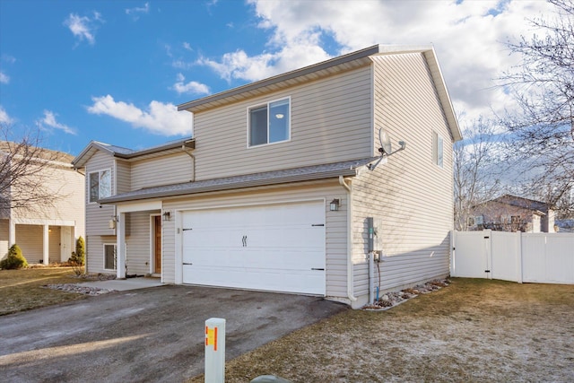 119 Barron Way, Kalispell, MT 59901 - traditional-style house with asphalt driveway and an attached garage