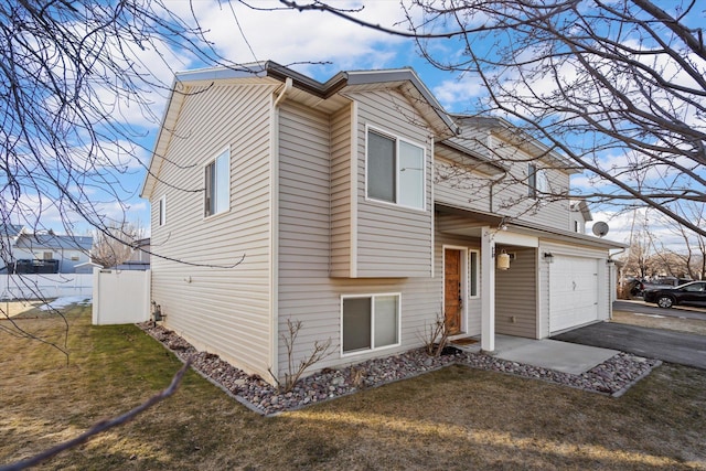 119 Barron Way, Kalispell, MT 59901 - view of home's exterior with driveway, a yard, and a garage