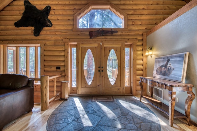 1062 Bear Creek Trl, Victor, MT 59875 - entrance foyer with plenty of natural light, log walls, and wood-type flooring