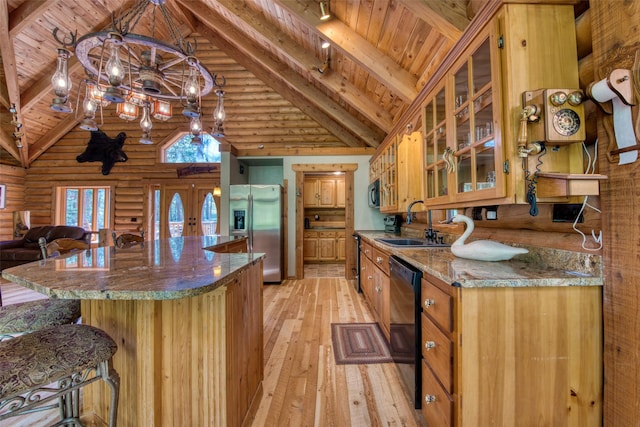 1062 Bear Creek Trl, Victor, MT 59875 - kitchen featuring black appliances, a chandelier, high vaulted ceiling, a wood ceiling with exposed beams, and light wood-style flooring